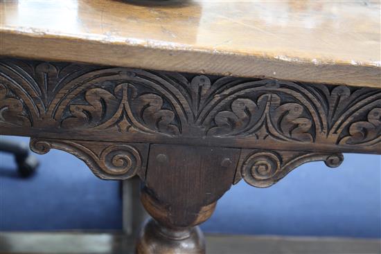 A large carved oak refectory table, 11ft 8in. x 2ft 11.5in. x 2ft 6.5in.